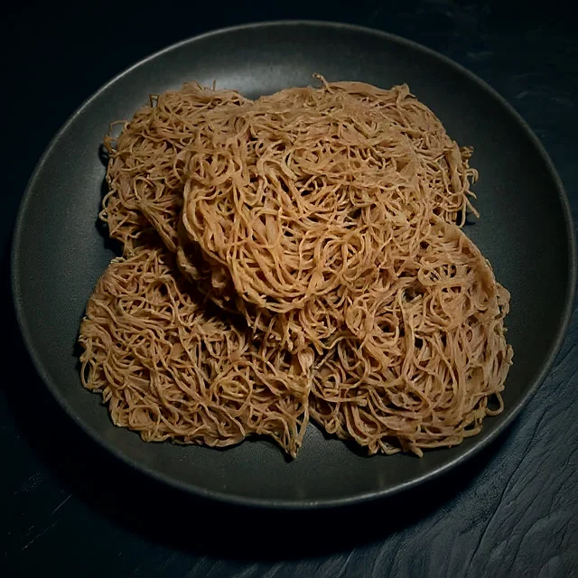 Red rice string hoppers, steamed in nests