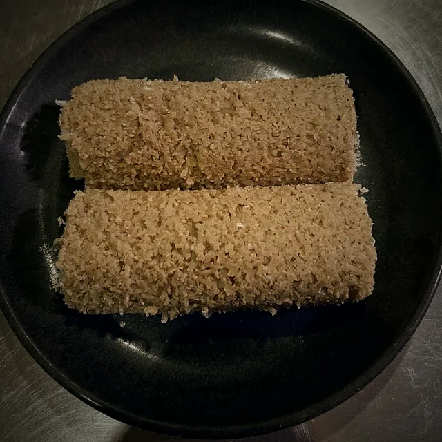Steamed pittu, rice flour and coconut cylinders